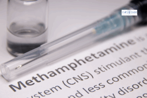 Syringe and vial next to methamphetamine definition, representing meth addiction treatment at Empower Health Group