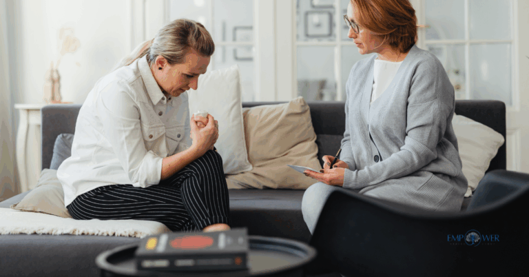 Therapist supporting woman during counseling session, representing intervention services at Empower Health Group