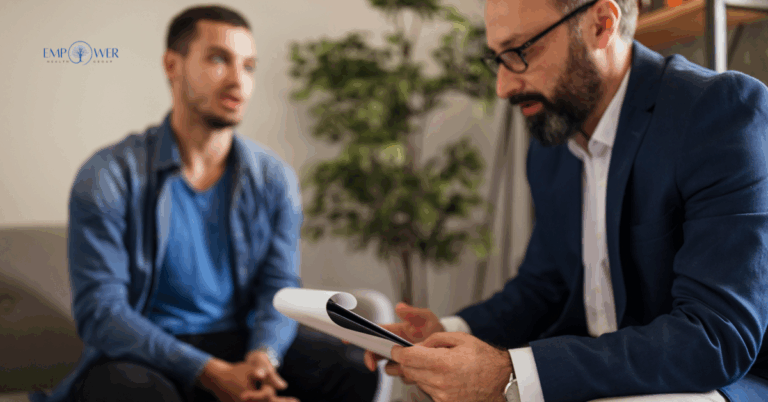 Male therapist talking with client during men’s therapy session at Empower Health Group
